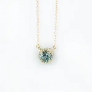 0.56ct Montana Sapphire and diamond halo necklace in 14k yellow